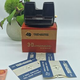 Visualizador View-Master 3D Vintage Modelo C em Baquelite Marrom com Caixa Original - 8 Conjuntos de Discos e 2 Discos Individu…